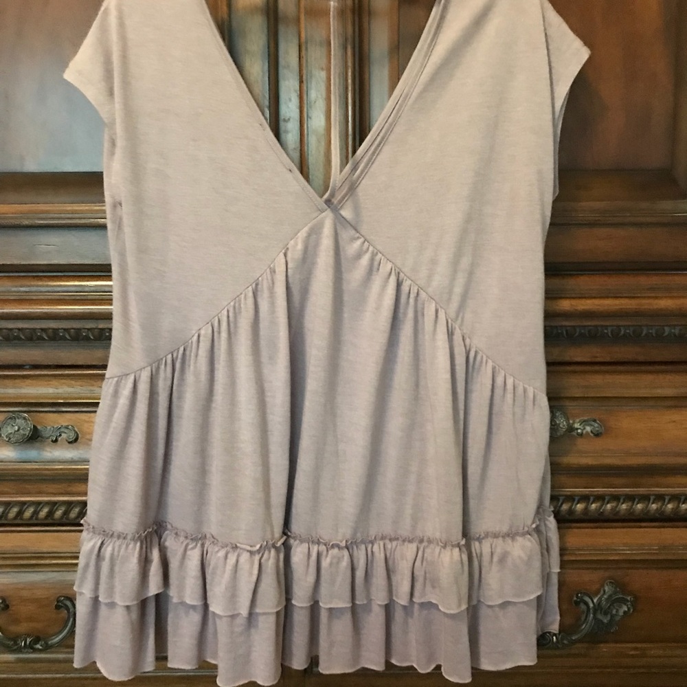 Stylish light lavender/rose shade ruffle top.